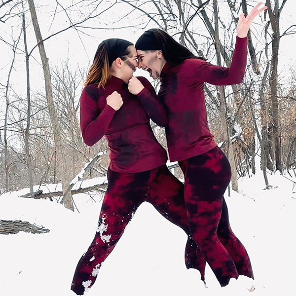 Two dancers dressed as damned souls preforming in snow